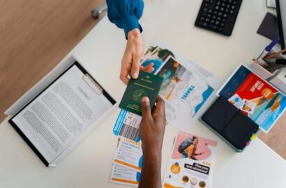 imgi_8_top-view-hands-holding-travel-documents_23-2150433383